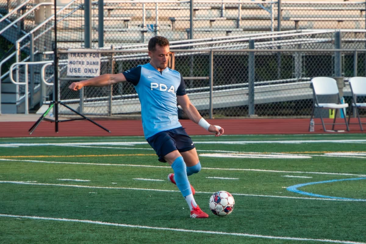 Coach Valeri striking the ball for PDA Hibernians